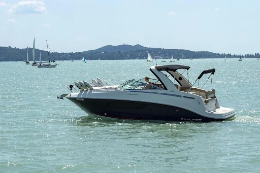 Family looking at boats for sale at a dealership